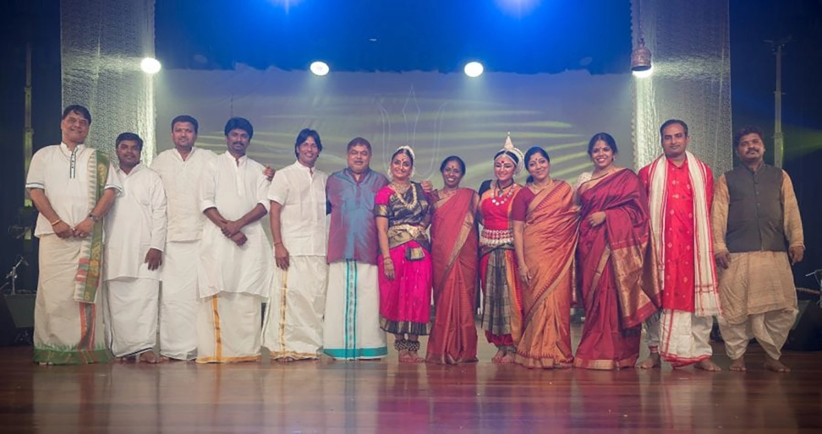 Mahamaya Dance Recital Raises Funds For Taarana 3 Dato Sri standing on stage with traditional dancers in traditional outfit