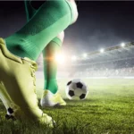 image of football player on the field about to kick a ball