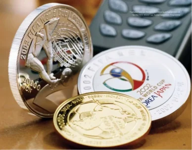 QNET collecting coins for FIFA World Cup 2002