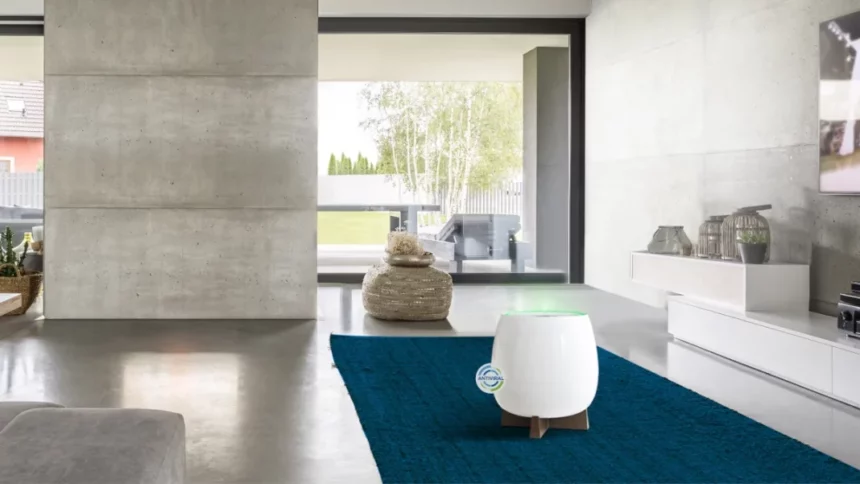 A stunning living space featuring a white and marble decor, with a HomePure Zayn unit on a blue carpet for indoor air pollution control.