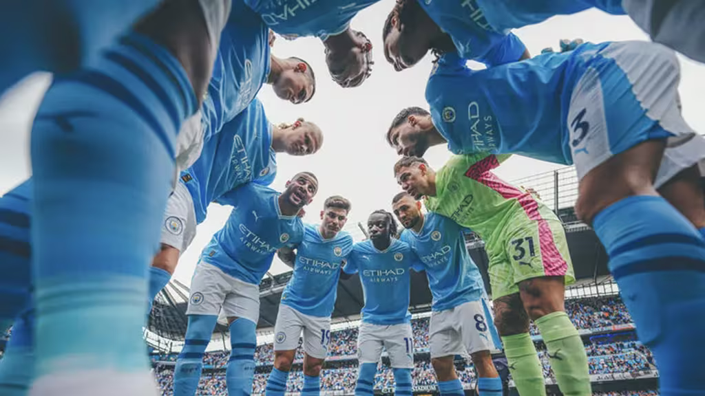 Why The English Premier League Is Still On Top After 30 Years 3 QNET-ManCity players, who have just been named Champions of the World 2023, huddle up before a game