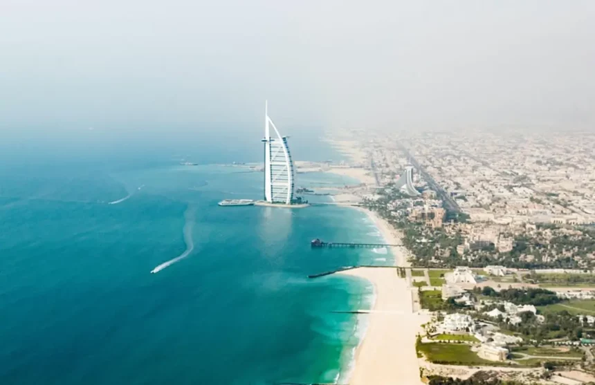 Stunning Dubai cityscape with water, merging urban and aquatic beauty.