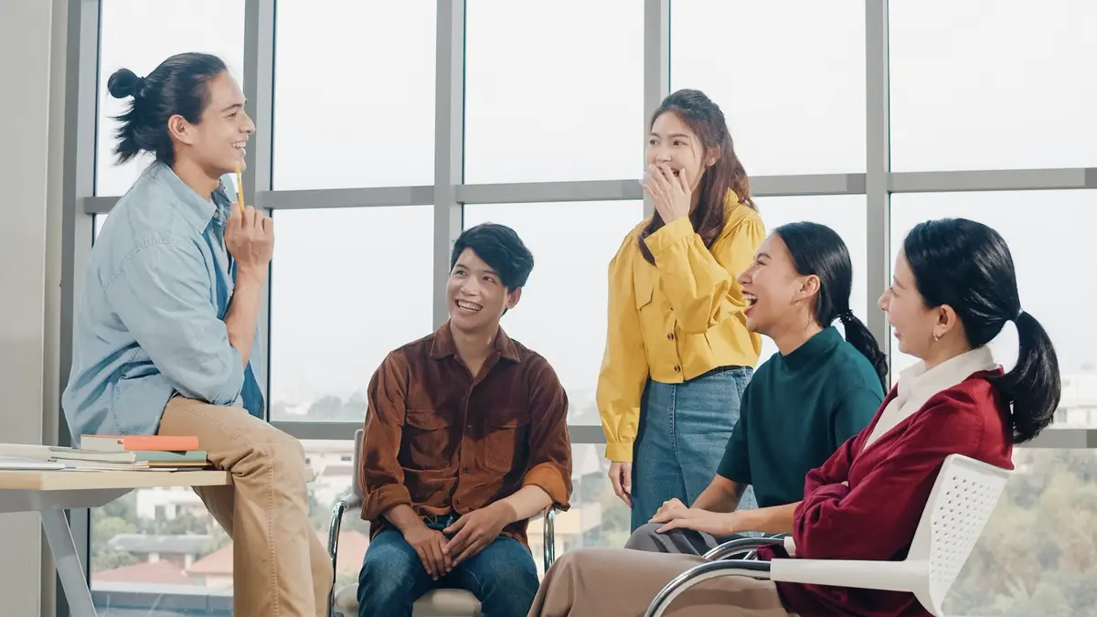 group of young people talking discussing work conversation starters