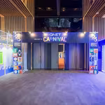 The vibrant entrance of the QNET Carnival, showcasing our commitment to sustainability at V-Convention 2023