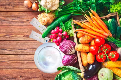 Spread of QNET products with various colourful vegetables show our many options for a vegetarian lifestyle