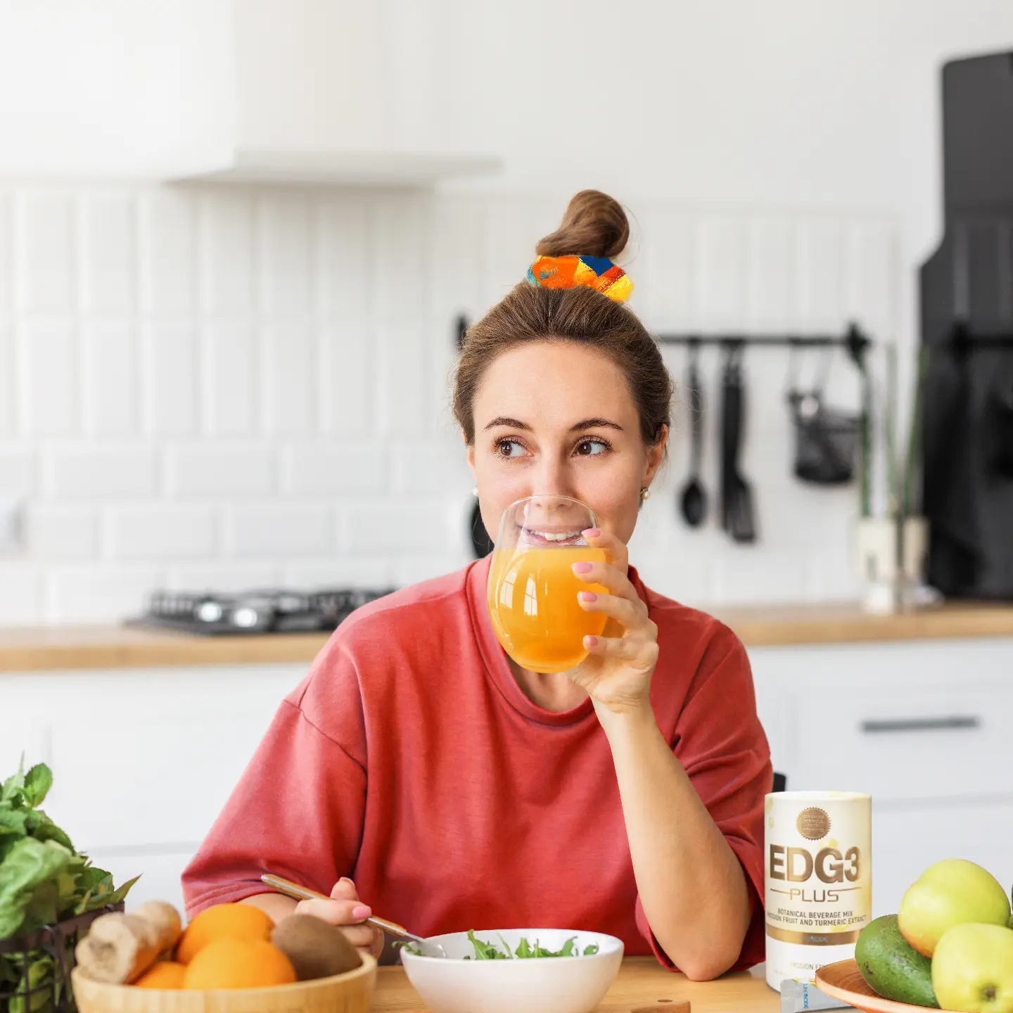 Woman drinking nutritious drink that boosts glutathione for immunity and eating a salad