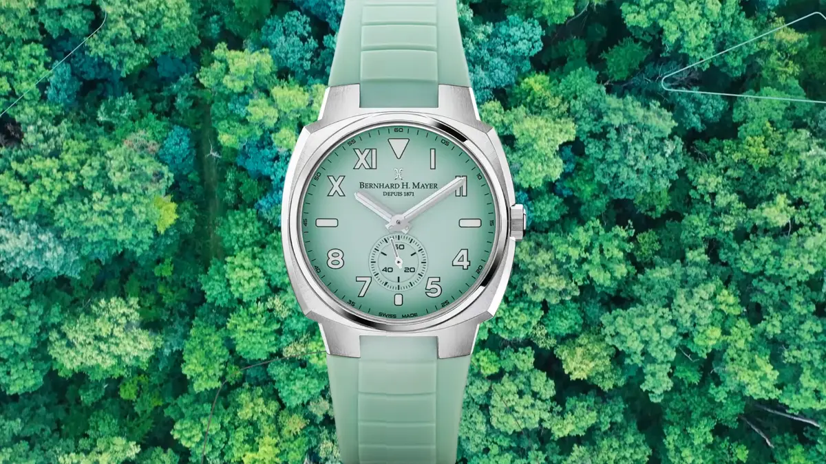 Green OMNI watch displayed above a top view image of trees
