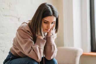 Sad woman wondering is the middle class the new poor?