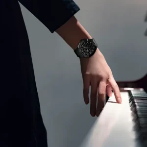 Qnet Watch Repair 18 Woman's hand on the piano; there is a Bernhard H. Mayer Alto Ceramic watch on her wrist